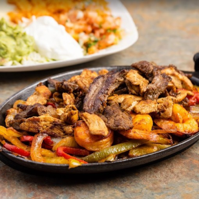 Sizzling Steak & Chicken Fajitas $24.75